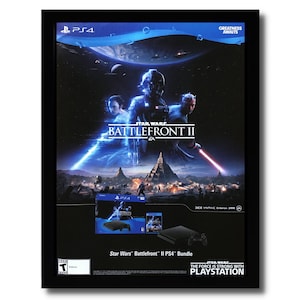 May include: A black framed poster advertising the Star Wars: Battlefront II video game for the Playstation 4. The poster features a dark blue background with a scene from the game, including characters from the Star Wars universe. The poster also includes the Playstation 4 logo and the game's title.