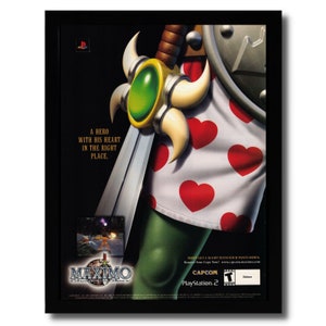May include: A video game advertisement for Maximo: Ghosts to Glory. The image features a character with a sword and a heart-patterned shirt. The text reads "A hero with his heart in the right place." and "Don't get caught with your pants down. Reserve your copy now! www.capcom.com/maximo"