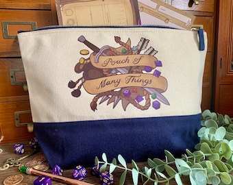May include: A cream and navy blue canvas zip-up pouch featuring a graphic illustration of a sword, rope, coins, and polyhedral dice with a tan banner displaying the text Pouch of Many Things in a dark brown script font across the centre.