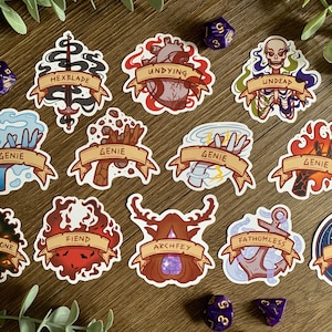 May include: A set of 12 colorful stickers featuring various fantasy creatures and magical elements. The stickers are circular and feature illustrations of a genie, a fiend, a great old one, an archfey, a hexblade, an undead creature, an undying creature, a fathomless creature, a celestial creature, and three different genie hands. The stickers are perfect for adding a touch of fantasy to your notebooks, journals, laptops, or other belongings.