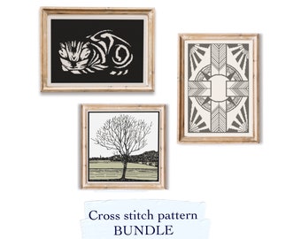 May include: A set of three cross stitch patterns, each framed in a light wood frame. The patterns are of a sleeping cat, a geometric design, and a tree in a field. The text "Cross stitch pattern BUNDLE" is written below the frames.