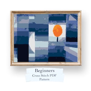 May include: A framed cross stitch pattern featuring a geometric design with a blue, white, and orange colour scheme. The title "Beginners Cross Stitch PDF Pattern" is written below the image.