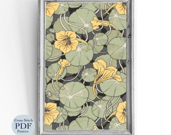 May include: Cross stitch pattern featuring a floral design with yellow flowers and green leaves. The pattern is framed in a gray frame.