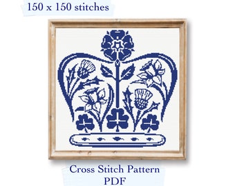 May include: A blue and white cross stitch pattern of a crown with floral designs. The pattern is 150 x 150 stitches and is labelled "Cross Stitch Pattern PDF".