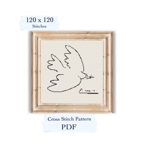 May include: A black and white cross stitch pattern of a dove in flight, with the artist's signature below. The pattern is framed in a light wood frame and measures 120 x 120 stitches. The text "Cross Stitch Pattern PDF" is printed below the frame.