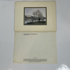 May include: A matted art print featuring a landscape painting by Jean-Baptiste-Camille Corot titled Ville d'Avray. The print shows a riverbank with trees and figures, accompanied by a separate sheet of paper with the artist's name and biography.
