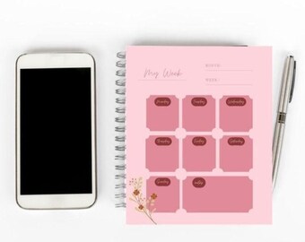 May include: A pink weekly planner with a floral design. The planner has a space for each day of the week, with the days of the week labeled in brown text.