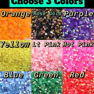 May include: A selection of 10 colors of small round rhinestones, including orange, rose gold, purple, yellow, light pink, hot pink, blue, green, and red. Choose 3 colors.