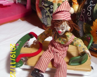 Vintage Ceramic Face Clown Doll on Sled: Bendable Arms, Wool Hair