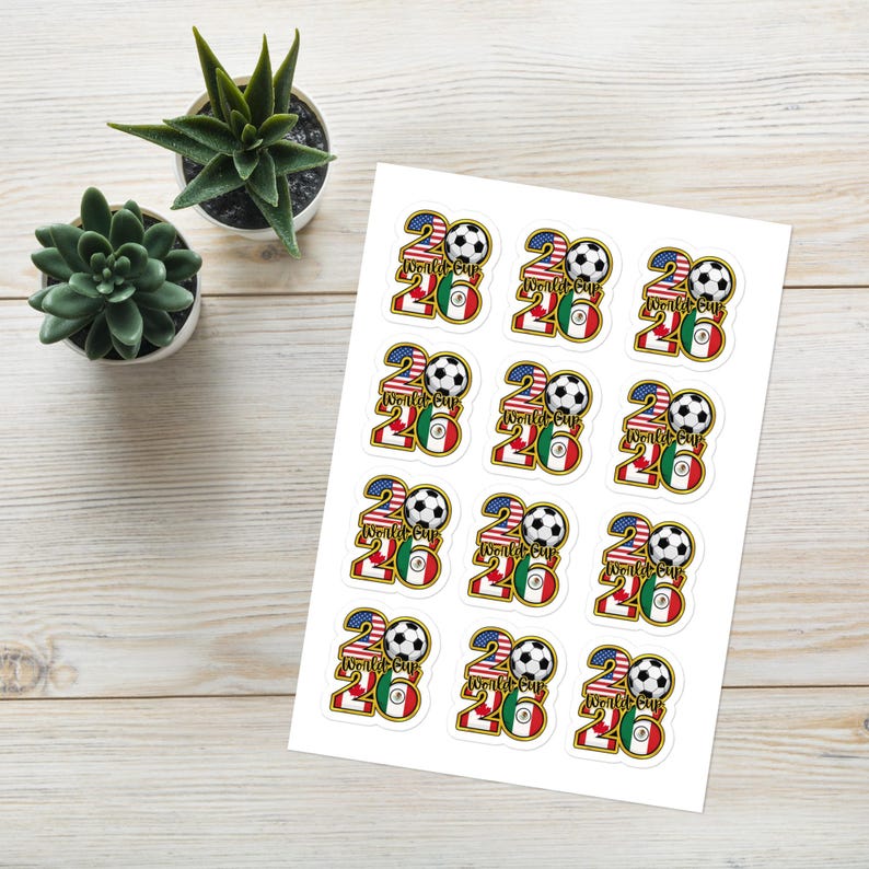 May include: A sheet of stickers featuring a soccer ball and the text "World Cup 2026". The stickers incorporate the flags of the United States, Mexico, and Canada. The stickers are white with colorful graphics.
