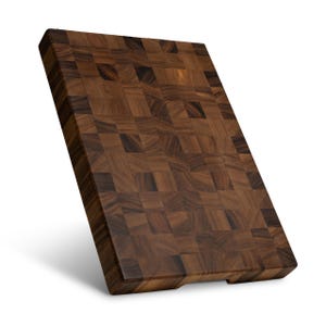May include: A rectangular wooden cutting board featuring a dark brown end-grain construction with a visible checkerboard pattern of varying wood tones. The surface displays natural wood grain variations and a smooth, finished texture throughout.