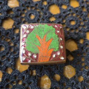 Gorgeous Vintage Brass Hinged tiny Pill Box Enamel? Intricate design Snuff box lidded box Asian trinket box featuring a tree on both sides