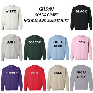 May include: Color chart for Gildan hoodies and sweatshirts. The chart shows 12 different colors: white, black, ash, forest, light blue, pink, purple, red, sand, and sport grey.