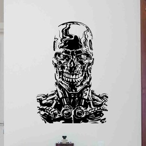 May include: Black and white silhouette wall decal of a robot skull with a menacing expression. The robot skull is detailed with intricate lines and patterns.