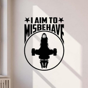 May include: Black wall decal featuring a silhouette of a spaceship inside a circle. Above the circle, the text reads "I AIM TO MISBEHAVE" with star accents. The decal is designed for wall decor.