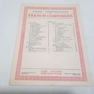 May include: A vintage sheet music page titled "Piano Compositions by French Composers." The page has a pink border and text. The publisher's name, Carl Fischer, is printed at the bottom, along with locations in Boston, New York, and Chicago.