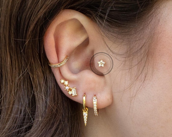 Beautiful jewelry for helix and tragus piercings with a beautiful star