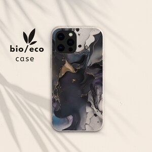 May include: A black and white marble phone case with gold accents. The case has a textured surface and a camera cutout. The text "bio/eco case" is visible in the image.