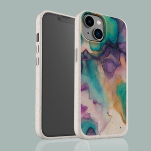 May include: A white phone case with a colorful abstract design. The case has a raised camera bump and a textured surface.