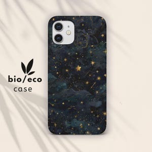 May include: A phone case with a dark blue and teal watercolor background, adorned with gold stars and constellations. The case has a glossy finish and the text "bio/eco case" is printed on the left side.