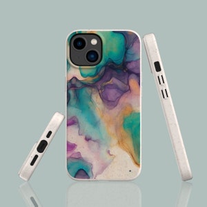 May include: A white phone case with a colorful abstract design. The design features shades of blue, green, purple, and yellow. The case is made of a textured material.