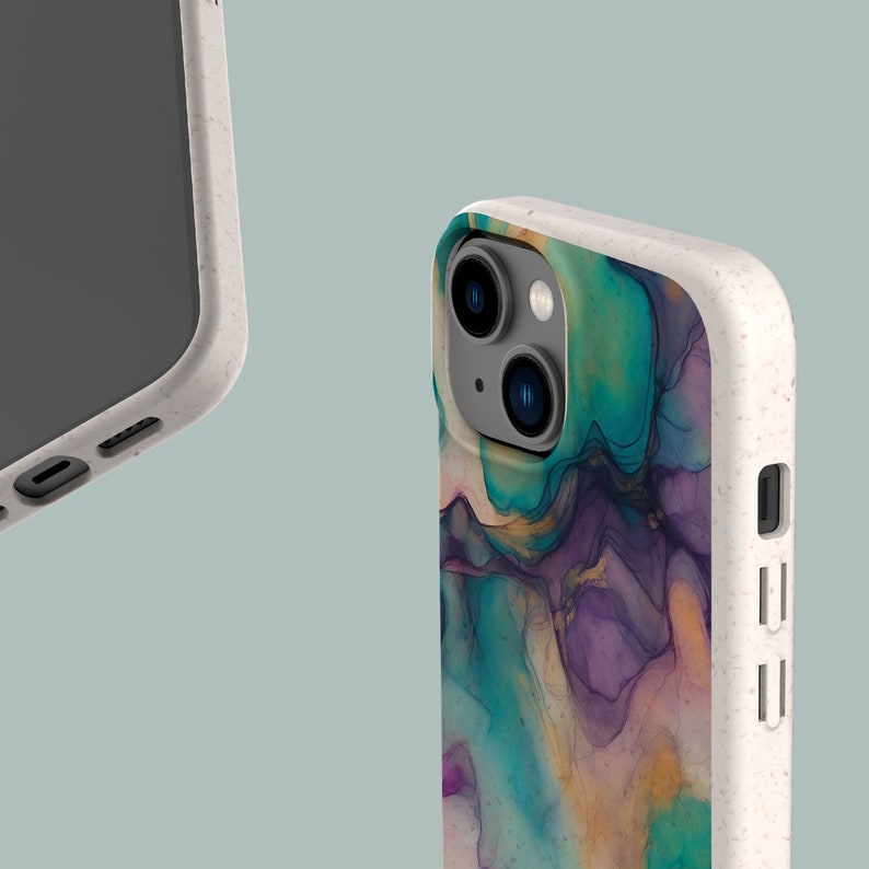 May include: A white phone case with a colorful abstract design. The case has a raised camera bump and a cutout for the charging port.
