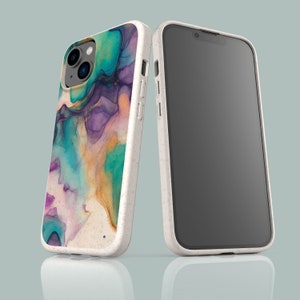 May include: A white phone case with a colorful abstract design. The case is made of a textured material and has a raised camera bump. The phone case is shown next to a black phone.