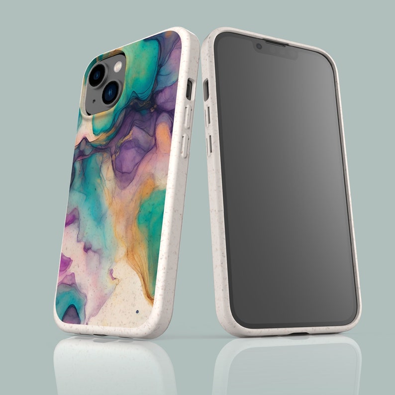 May include: A white phone case with a colorful abstract design. The case is made of a textured material and has a raised camera bump. The phone case is shown next to a black phone.