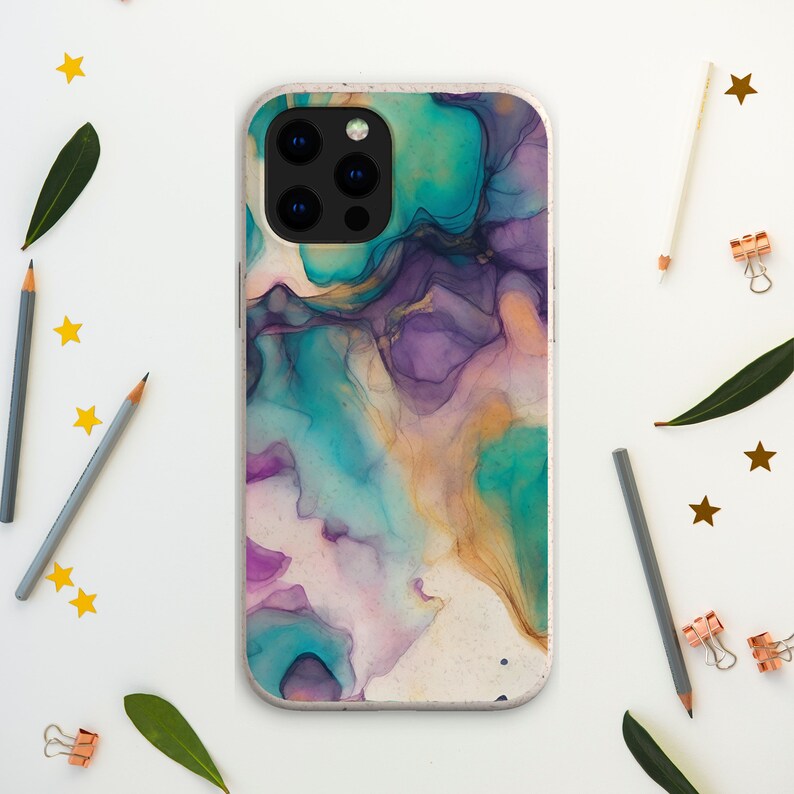 May include: A phone case with a colorful abstract design featuring shades of teal, purple, and gold. The case has a white background and a textured surface.