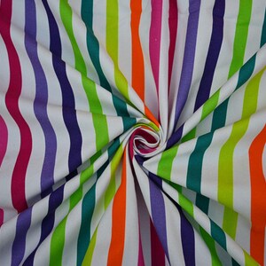 May include: A vibrant fabric with vertical stripes in a rainbow of colors, including pink, orange, green, purple, and teal, against a white background. The fabric is gathered in the center, creating a swirling pattern. This textile is suitable for various craft projects.