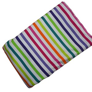 May include: A rectangular fabric with a vibrant rainbow stripe pattern. The stripes alternate between white, teal, green, purple, pink, orange, and white. The edges are finished with a pink trim.