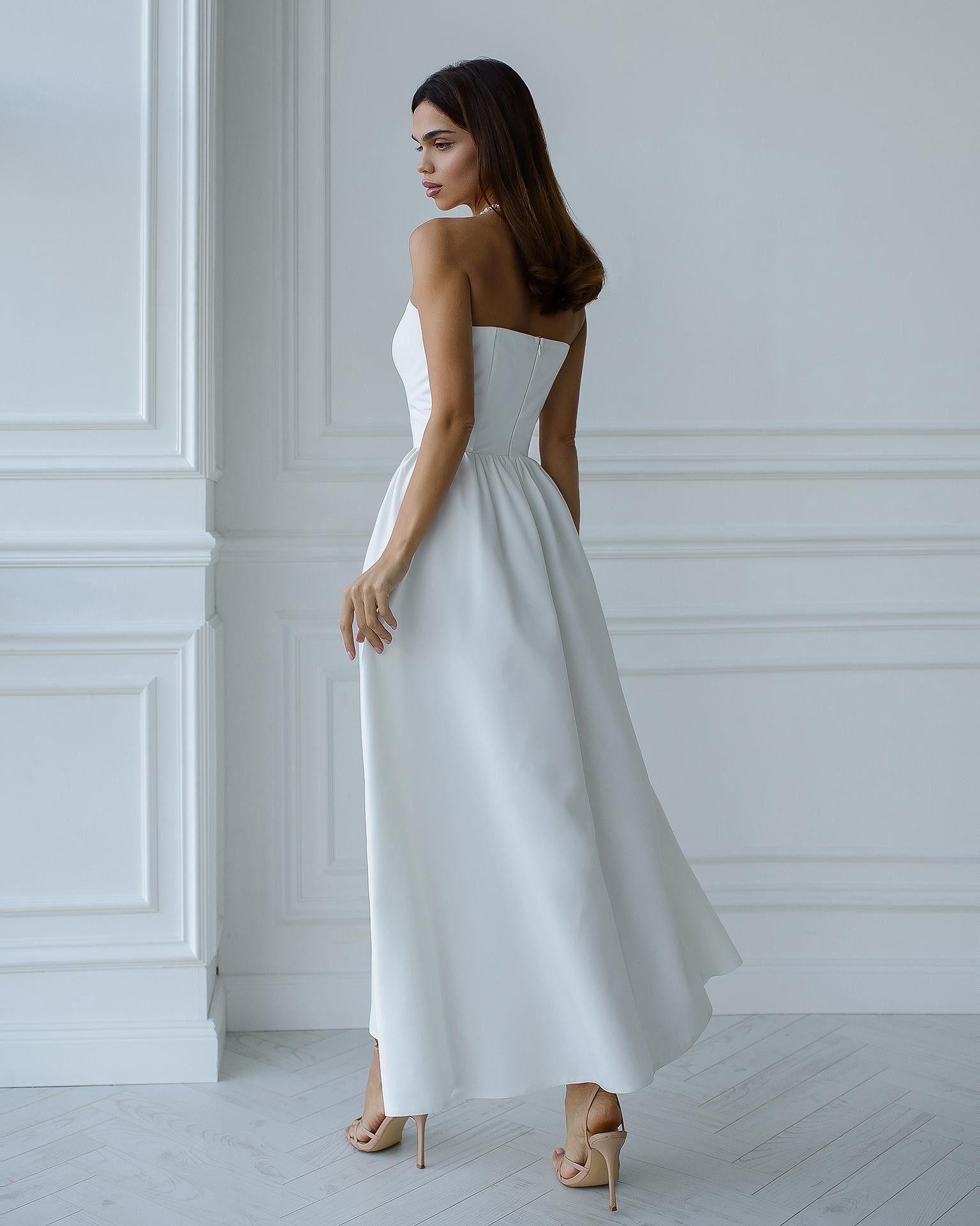 White strapless corset V-waisted tea length dress