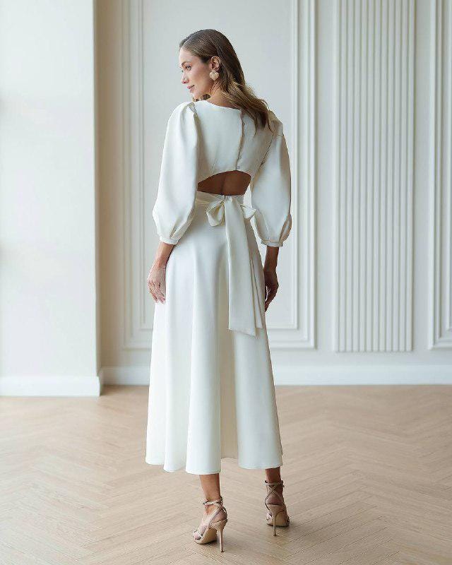 White midi dress with puff sleeve and flared skirt White midi dress with puff sleeve and flared skirt