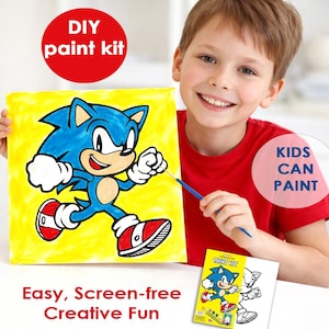 May include: A child holds a canvas painted with Sonic the Hedgehog on a yellow background. The words "DIY paint kit" and "Kids Can Paint" are visible. The kit includes a paint kit box with a Sonic illustration and the text "Easy, Screen-free Creative Fun."