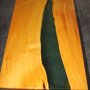 May include: A wooden coffee table with a dark green epoxy resin river running down the centre.