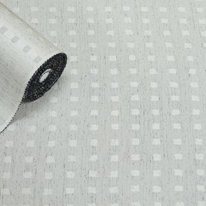 May include: A roll of white fabric with a subtle textured pattern. The fabric has a black edge and is rolled up.