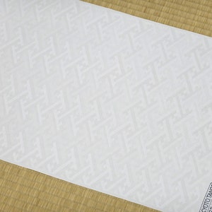 May include: White fabric with a subtle embossed geometric pattern. The fabric is labeled "Kyoto Tango Silk 100%".