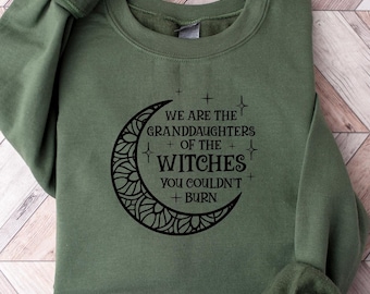 May include: Green sweatshirt with a black crescent moon graphic and the text "We are the granddaughters of the witches you couldn't burn."