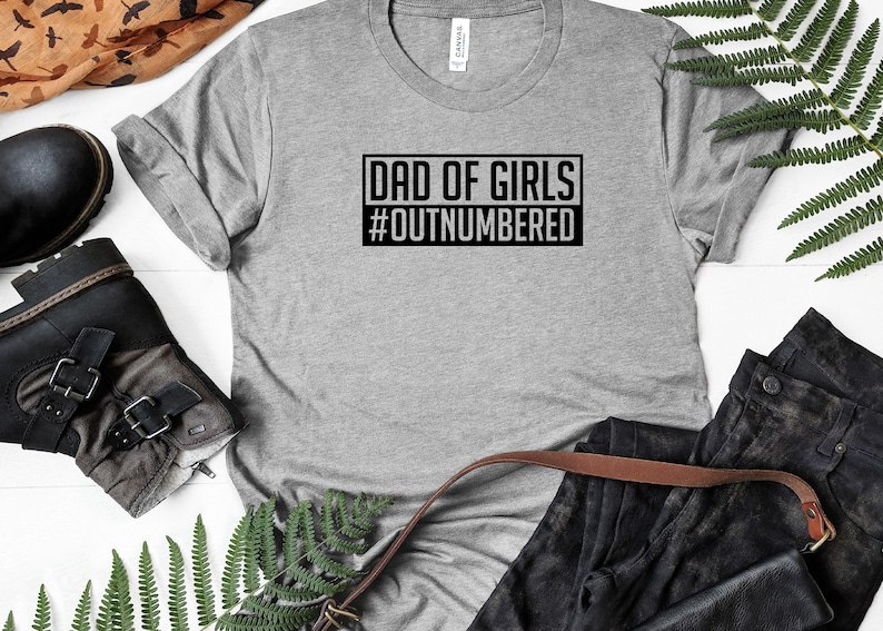 May include: Gray t-shirt with black text that reads "Dad of Girls #Outnumbered".