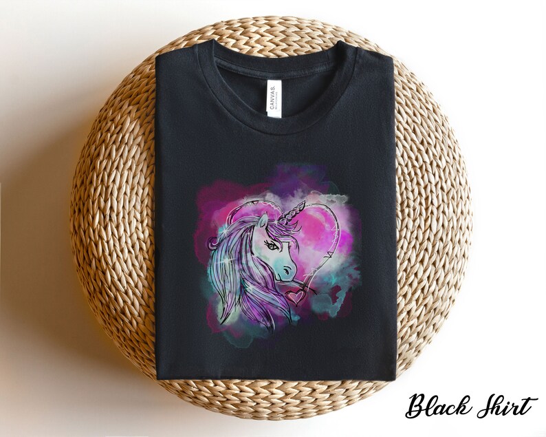 May include: Black t-shirt with a colorful graphic of a unicorn's head inside a heart shape.