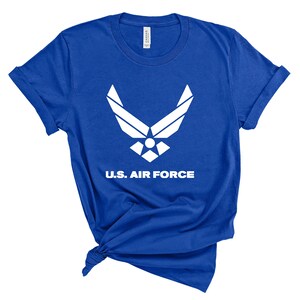 May include: A royal blue t-shirt with a white U.S. Air Force logo and the text "U.S. AIR FORCE".