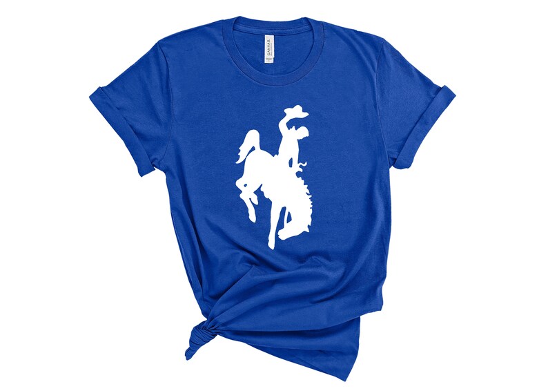 May include: A royal blue t-shirt with a white silhouette of a bucking bronco.