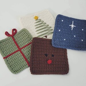 May include: Four crocheted coasters with different designs. One is green with a red ribbon, one is brown with a red nose and eyes, one is white with a green Christmas tree, and one is blue with a white star.