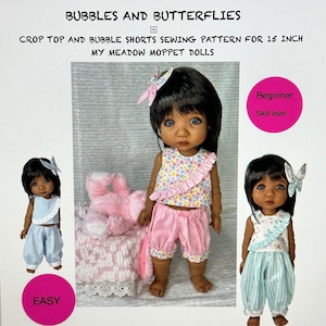 May include: A sewing pattern for a 15-inch doll, featuring a crop top and bubble shorts. The pattern is titled "Bubbles and Butterflies" and is labeled as "Beginner" skill level. The pattern is designed by Diane Coykendall.