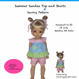 May include: A doll wearing a summer sundae top and shorts sewing pattern. The top is a mix of pink, blue, and green gingham fabric with a ruffle and pocket. The shorts are pink. The pattern is designed to fit 18-inch Meadow BB dolls.