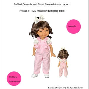 May include: A pattern for ruffled overalls and a short-sleeved blouse for 11-inch My Meadow dolls. The pattern is designed for an intermediate skill level and has a loose fit. The image shows two dolls wearing the finished garments.