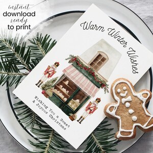 May include: A holiday greeting card with a watercolor illustration of a bakery, nutcrackers, and a gingerbread man. The card reads "Warm Winter Wishes" and "Wishing You a Sweet & Joyous Christmas". The words "instant download ready to print" are also visible.