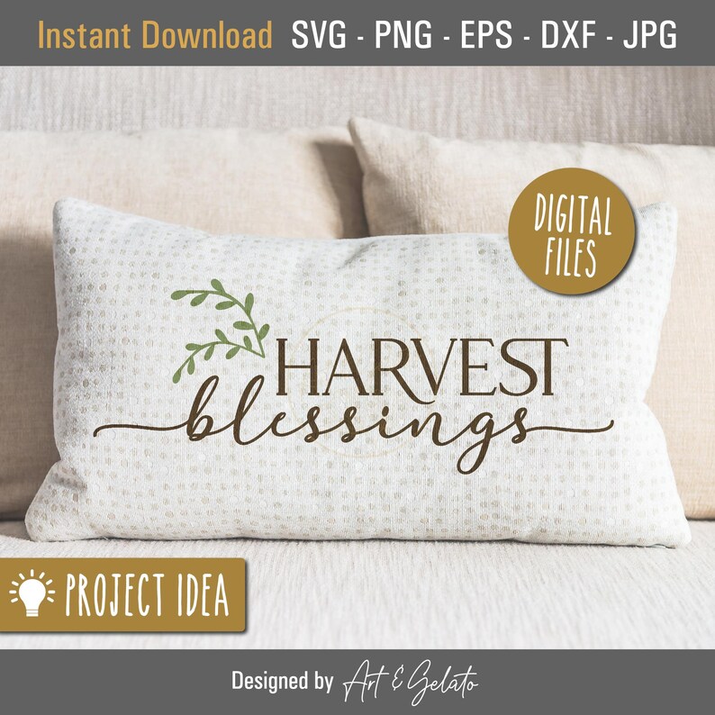 May include: A white pillow with the text "HARVEST blessings" in brown lettering and a green leafy sprig above the text. The pillow is on a beige couch.