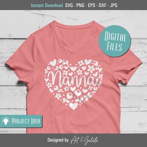 May include: A pink t-shirt with a white heart design featuring the word "Nanna" surrounded by flowers and hearts.