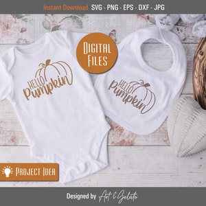 May include: A white onesie and bib with the text "Hello Pumpkin" and a pumpkin graphic in brown.